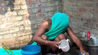 Desi Radhika’s Steamy Village Bath in Hindi