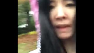 Soaked and shameless: Asian babe bares all in the downpour