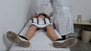Doctor’s hands exploring her naked belly during the intimate checkup.